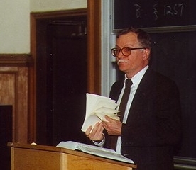 Professor lecturing at podium
