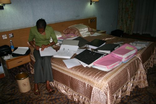 Preparing judgments for scanning in a hotel room in Uganda