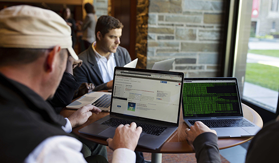 Group of people working on laptops